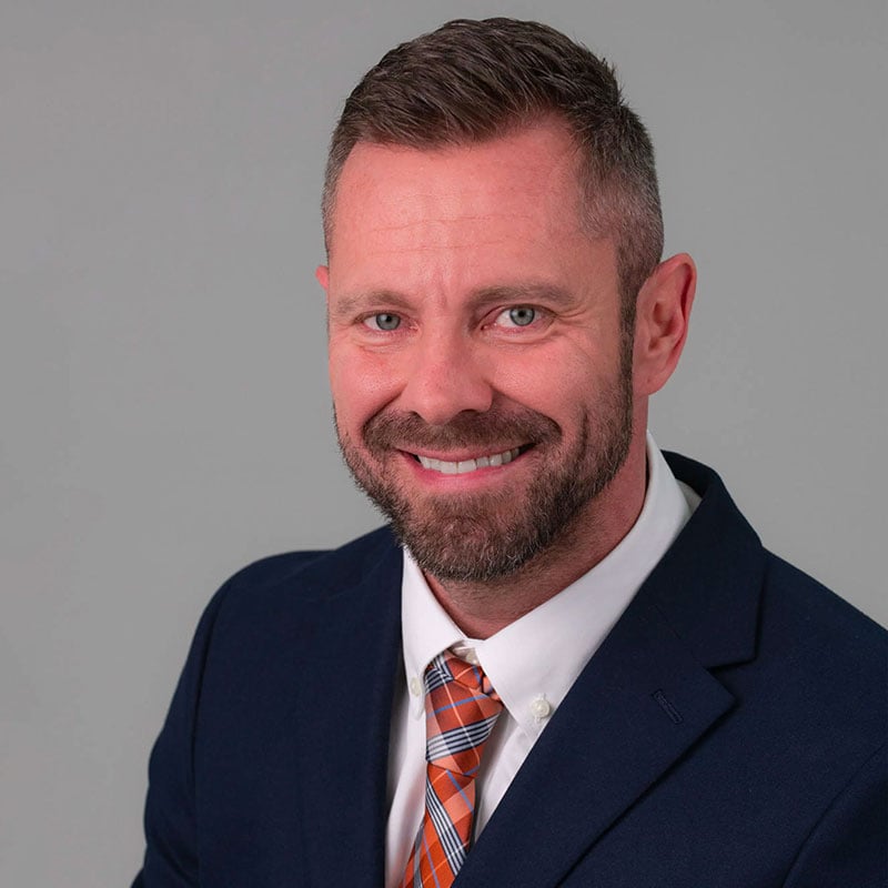 a man with a beard and a suit