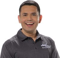 a man in a black shirt smiling