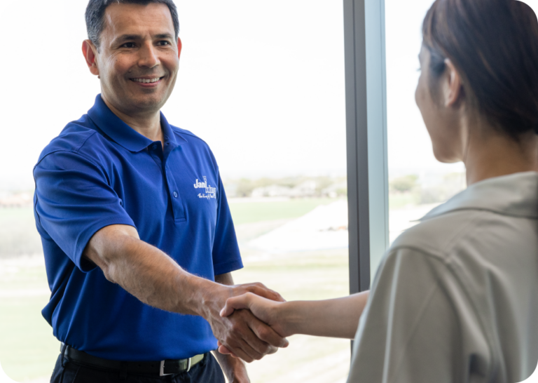 a man shaking hands with a woman