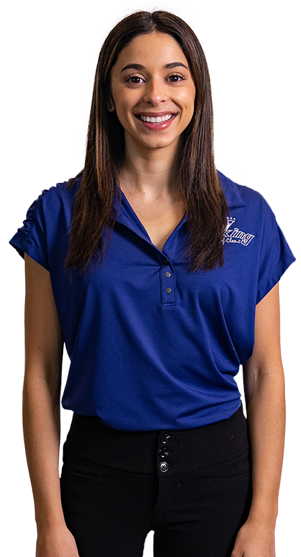 a woman in a blue shirt and black pants